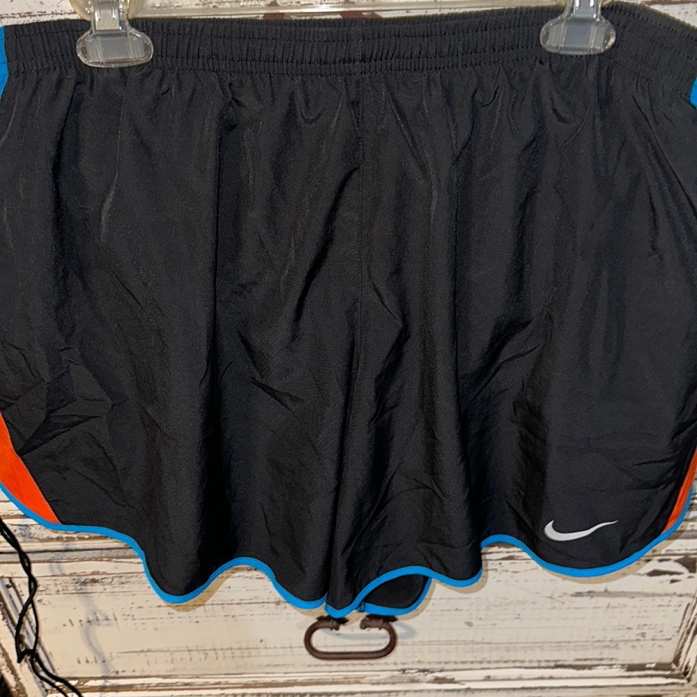 Nike dri fit black with blue and orange on side shorts with drawstring lined 1x